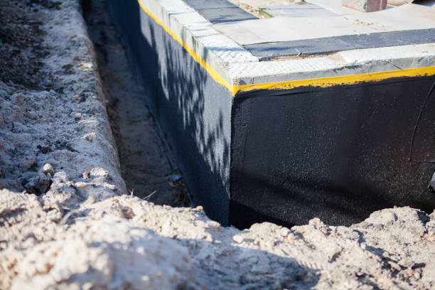 Professional Basement Waterproofing technician working in Massapequa, NY